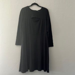 Plus size women’s black Eloquii dress with front cutout detail
